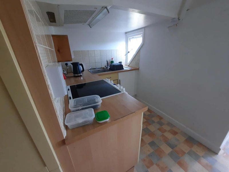 Photo 1: Kitchen - low ceiling by sink