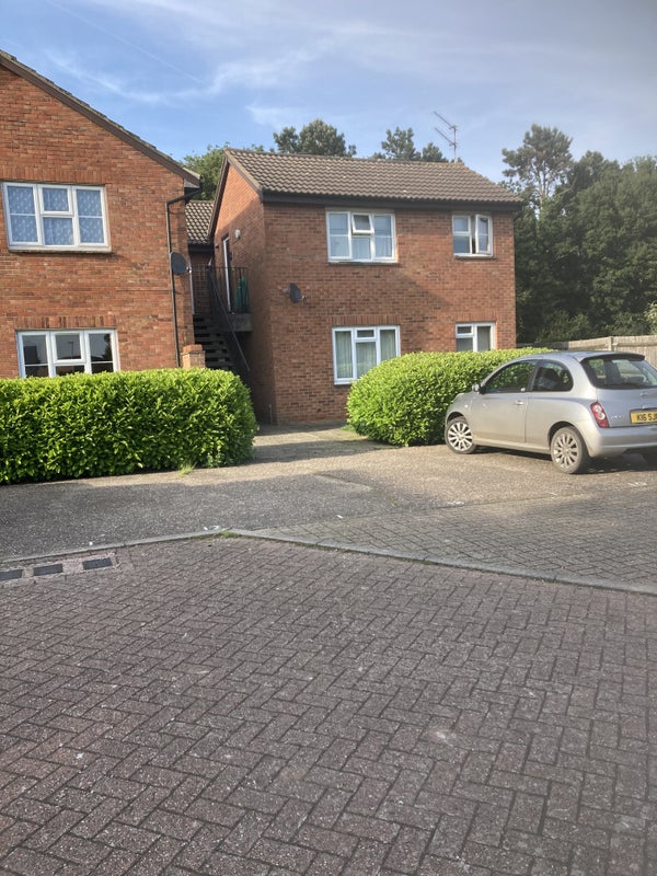 Photo 1: Two parking spaces