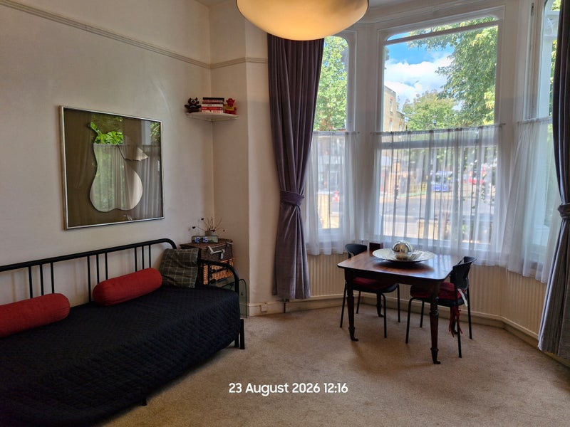Photo 1: Welcoming ground floor studio with tall ceilings + large windows