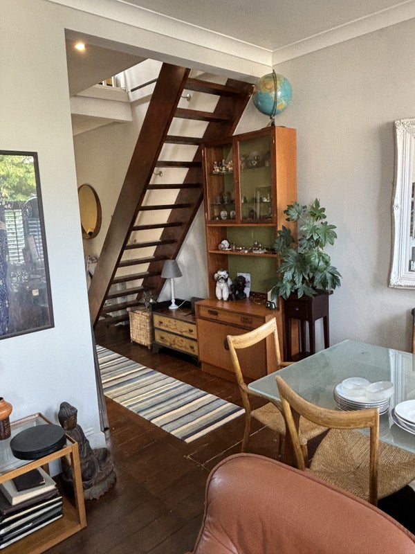 Photo 1: Stairs leading to tenants room with door for privacy 