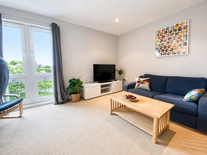 Photo 1: Bright top-floor lounge with Juliet balcony