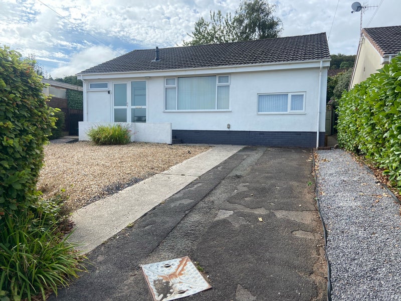 Photo 1: Front of bungalow with ample parking