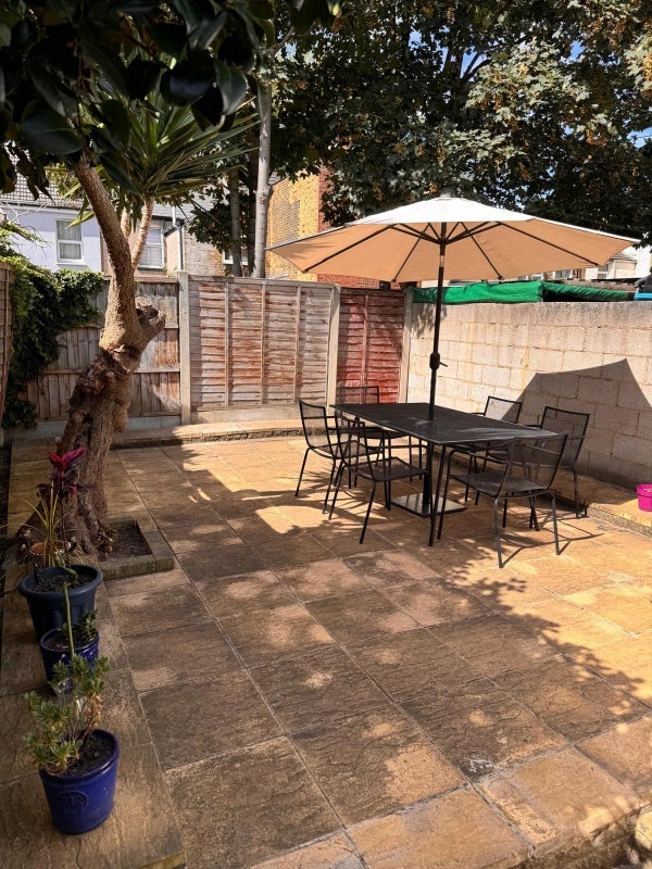 Photo 1: REAR PATIO WITH BBQ