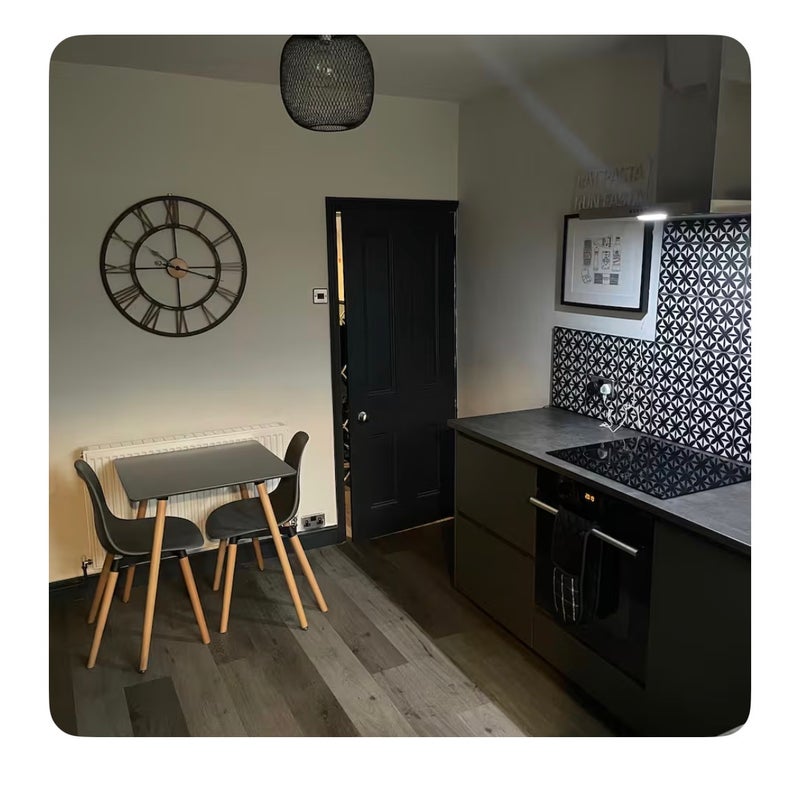 Photo 1: Kitchen and dining area
