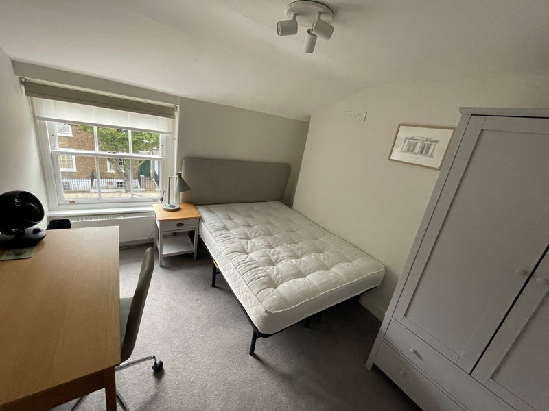 Photo 1: Bedroom with double bed that is bright and sunny