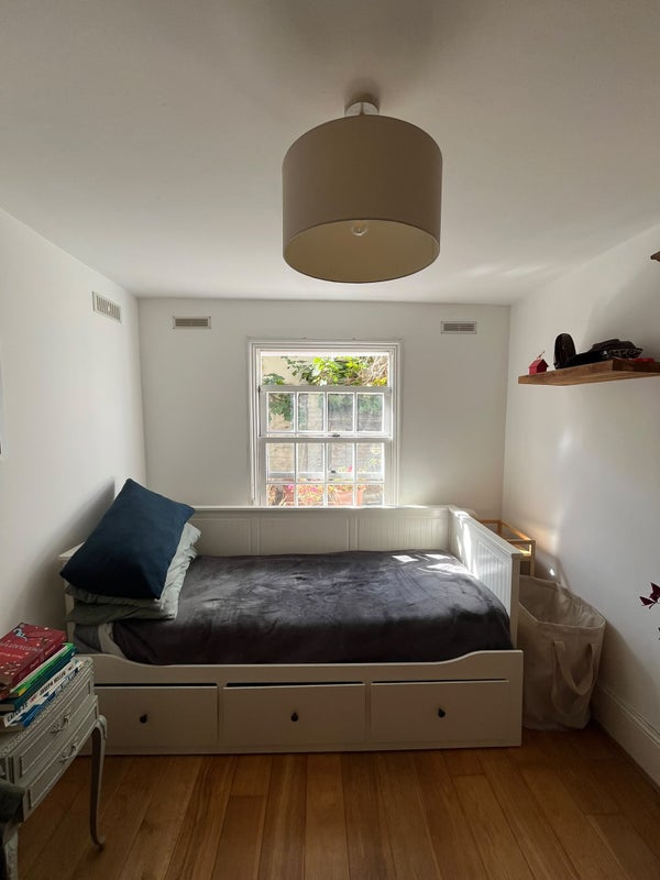 Photo 1: Bed opens up into a double