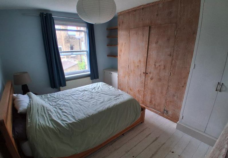 Photo 1: The bedroom has a double bed.