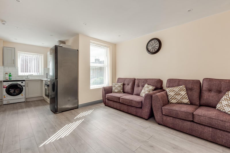 Photo 1: Kitchen/ Living Area 