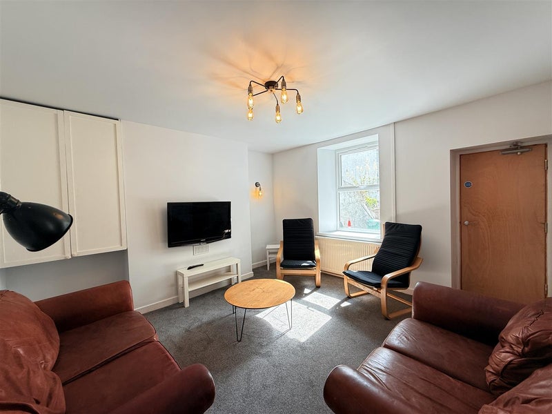Photo 1: Lounge with TV