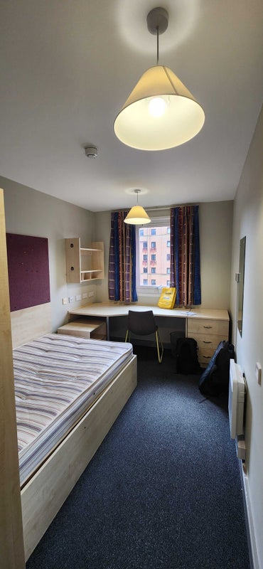 Photo 1: Bedroom with loooong desk.