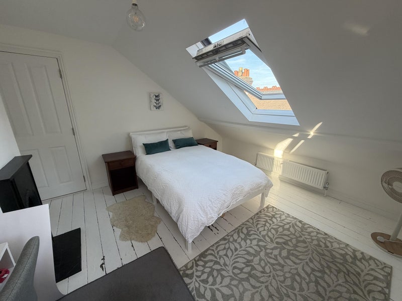 Photo 1: Double bedroom (top floor) includes small double bed, desk and wardrobe.