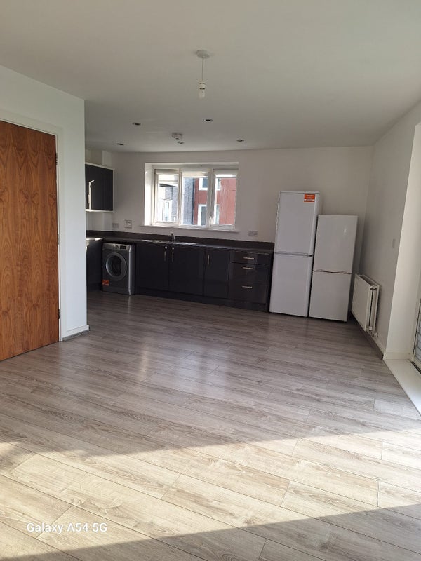 Photo 1: Kitchen and dining area with 2 fridge