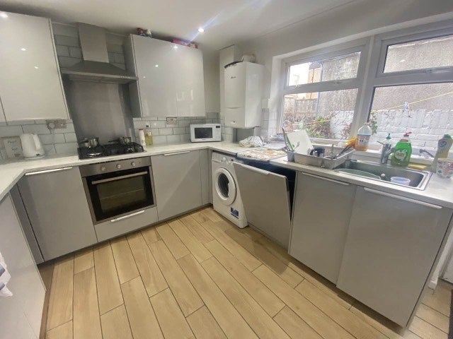 Photo 1: Kitchen with door to garden