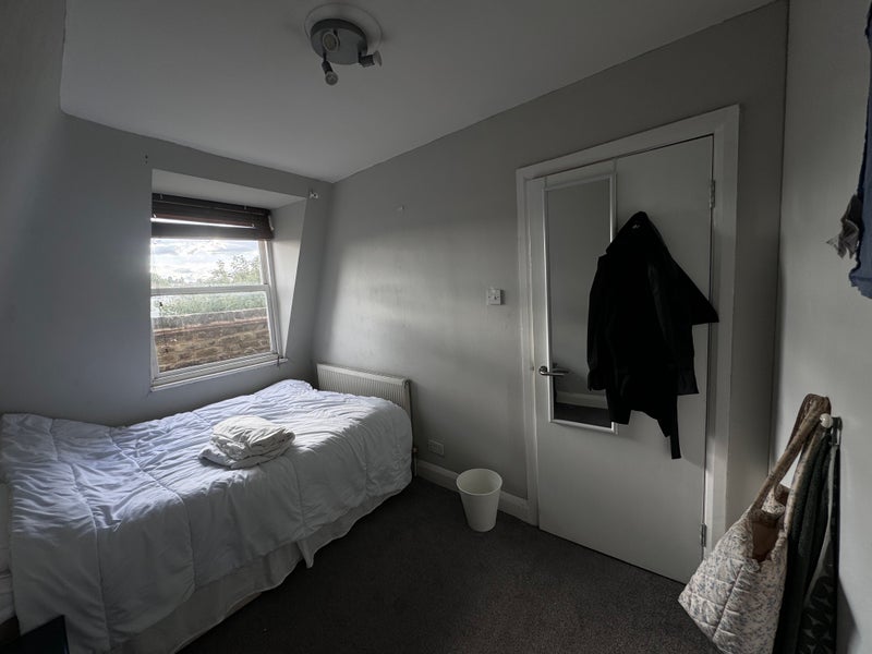 Photo 1: Room 2 — smaller furnished bedroom