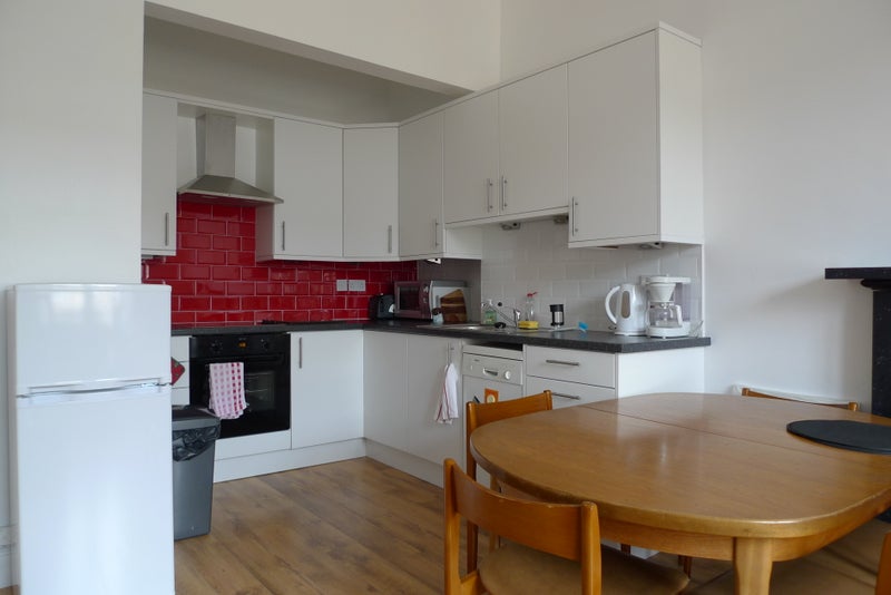 Photo 1: Shared kitchen/living room