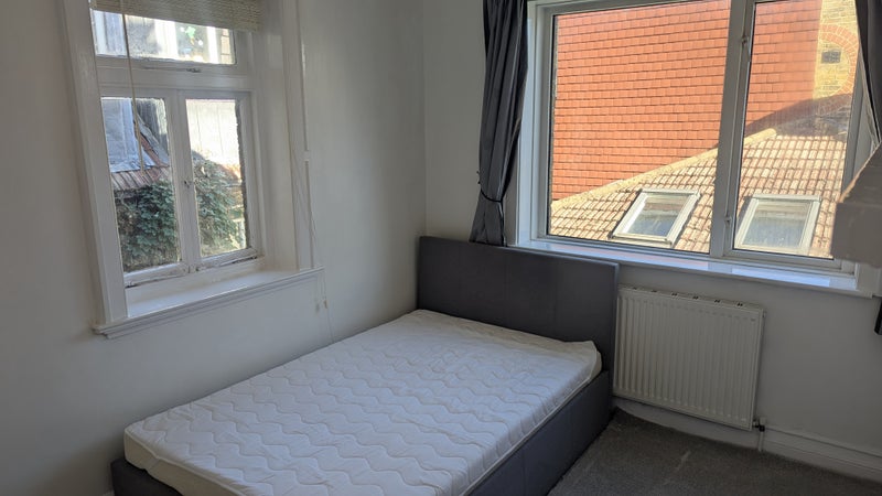 Photo 1: Bedroom — main view with bed and both windows