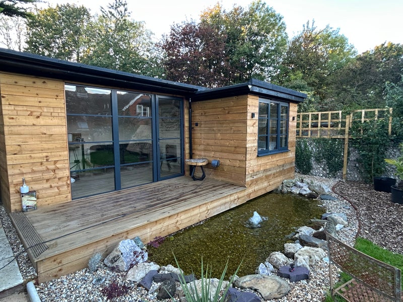 Photo 1: Self Contained Out Building