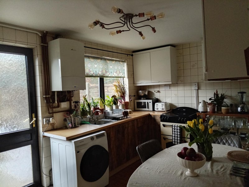 Photo 1: Retro/modern kitchen including miele fridge freezer and personal storage.