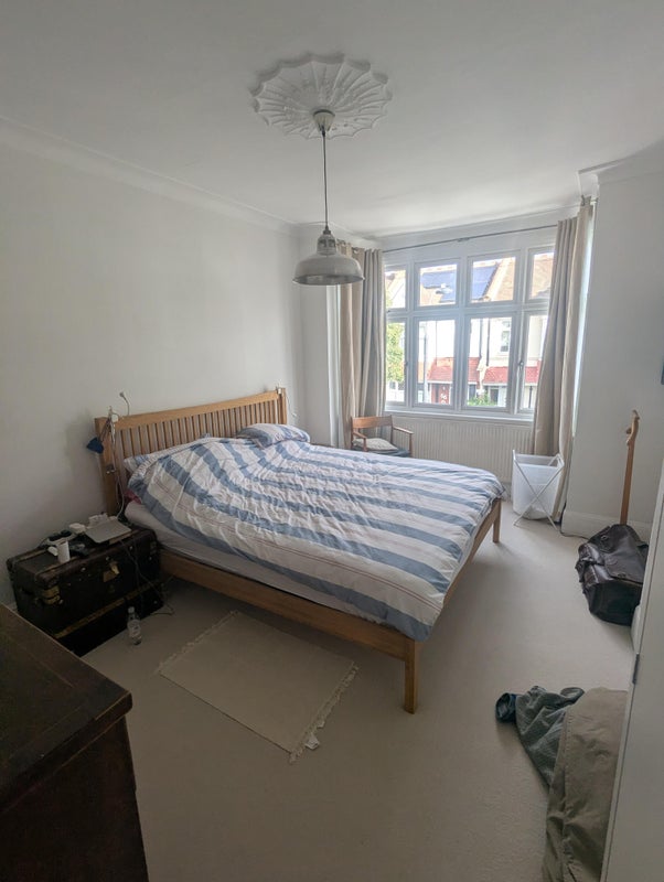 Photo 1: Bedroom with  king size bed and large TV
