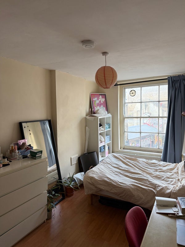 Photo 1: The room with window looking out on brick lane