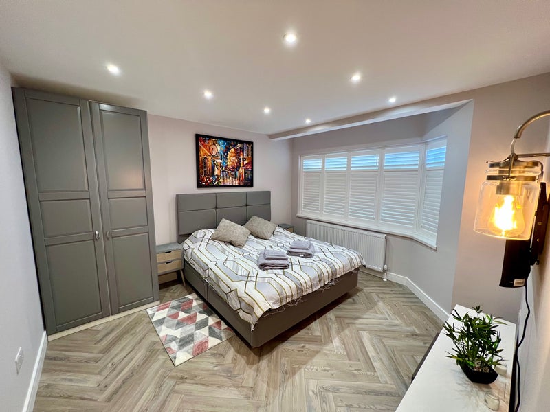 Photo 1: King-size comfort, custom shutters and space to unpack properly.