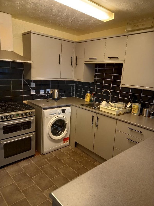 Photo 1: Kitchen with washing machine