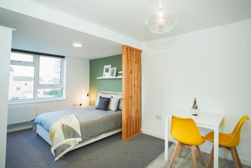 Photo 1: Bedroom & dining/work area