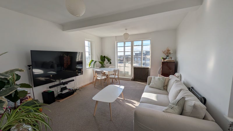 Photo 1: Living Room with Private Balcony