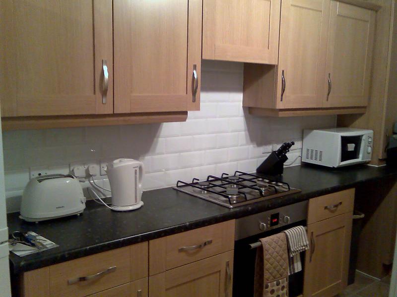 Photo 1: Kitchen area