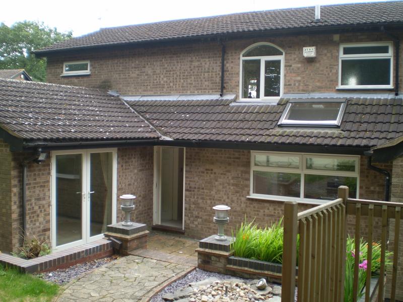 Photo 1: Rear of house (Patio door is vacant bedroom)