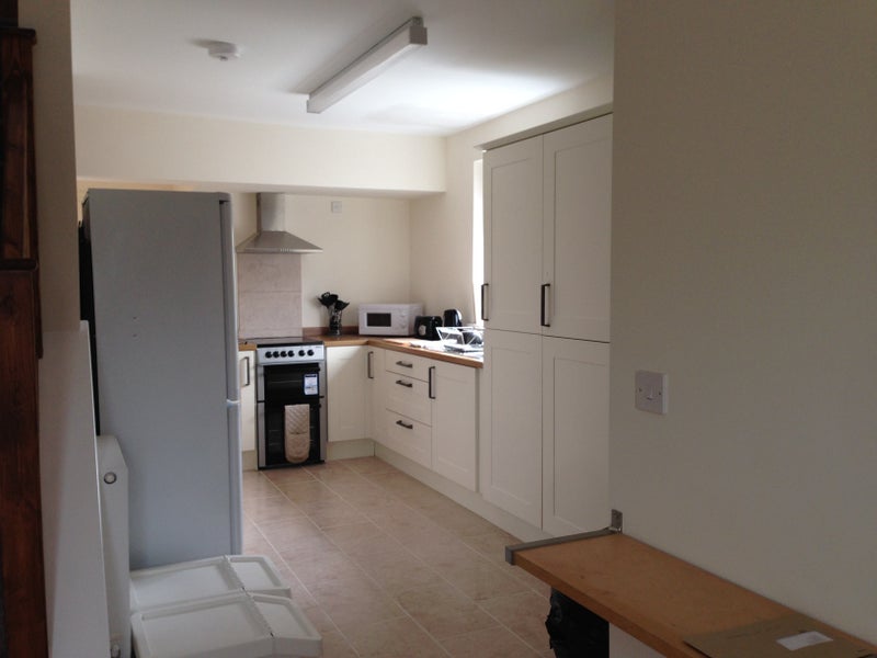 Photo 1: Kitchen with allocated storage space