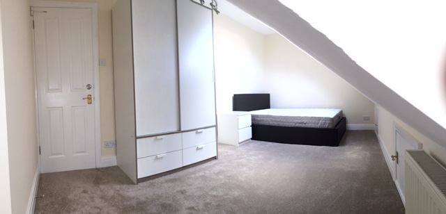 Photo 1: The cosy room with a double ottoman bed and large wardrobe, there is eaves storage too