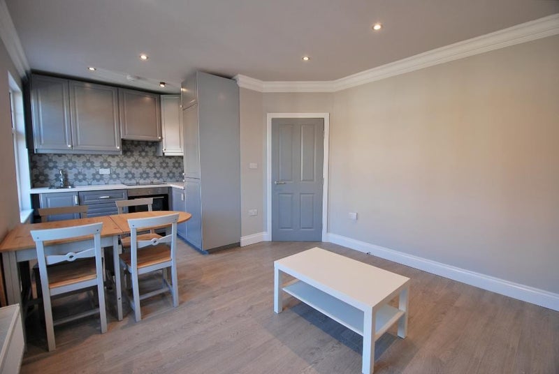 Photo 1: Kitchen/dining area