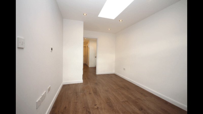 Photo 1: Bright bedroom with skylight