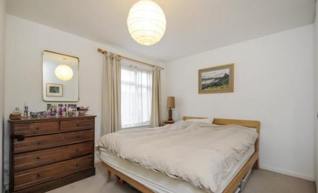 Photo 1: Bedroom 1 with views over the garden