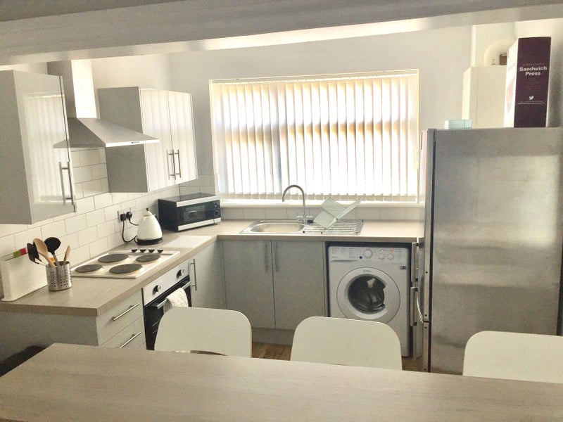 Photo 1: Kitchen (view from living room)