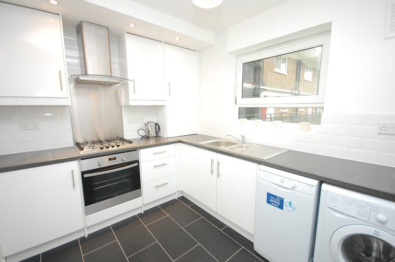 Photo 1: Kitchen with fridge-freezer, dishwasher, table and chairs
