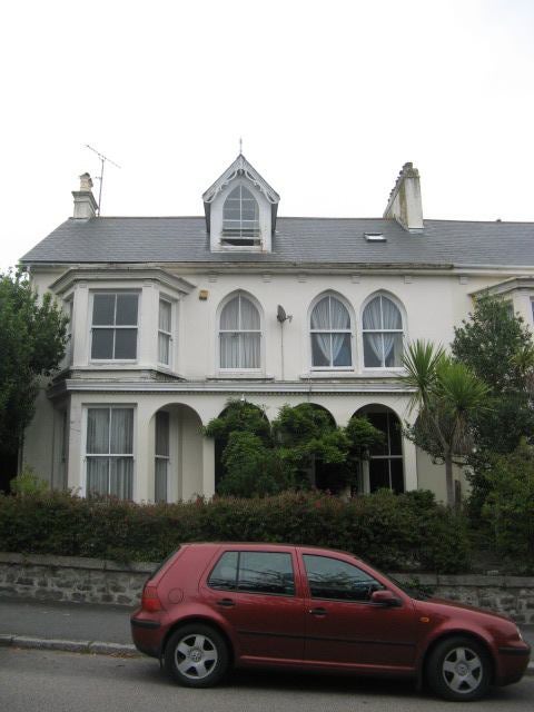 Photo 1: Front of House facing park