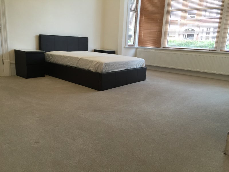 Photo 3: The comfy double bed with storage underneath and 2 bedsides