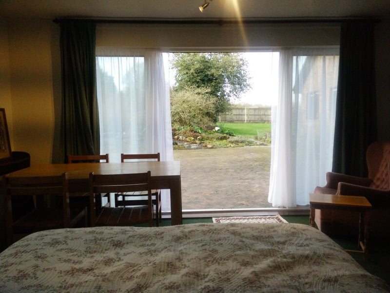 Photo 1: View through patio doors