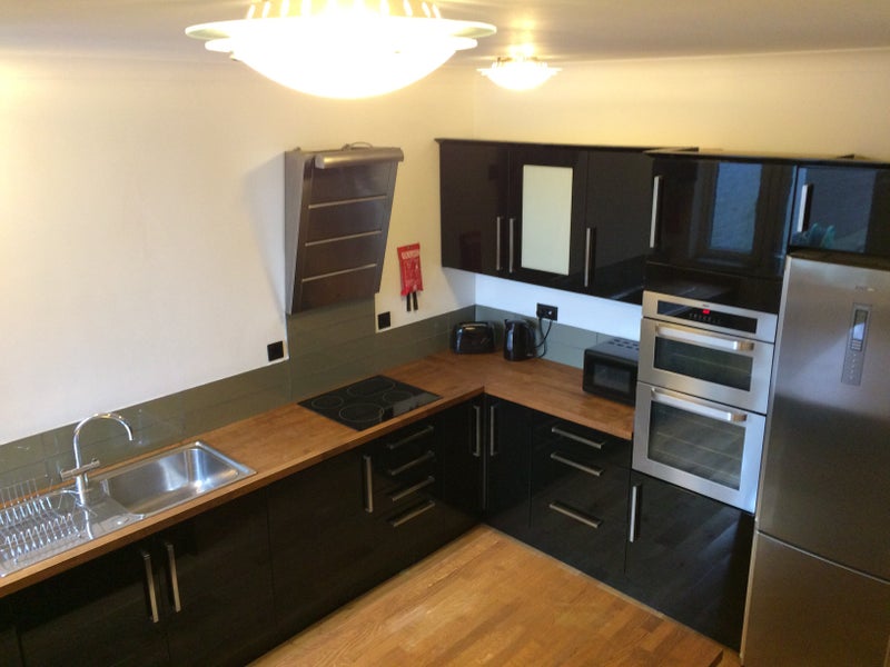 Photo 1: Shared Kitchen Leading To Garden