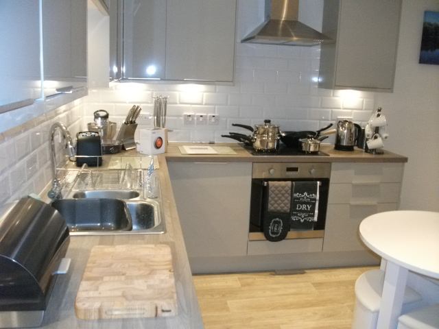 Photo 1: Kitchen area