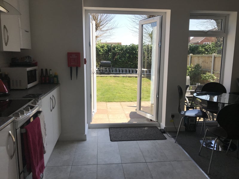 Photo 1: Lovely quiet garden with table chairs and shed