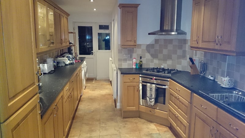 Photo 1: The shared kitchen is fully kitted out