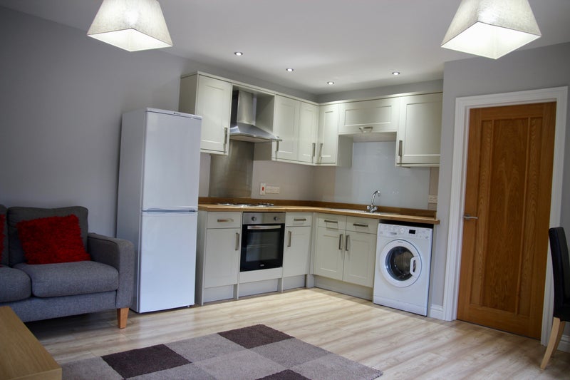 Photo 1: Bright and Airy Living room with kitchen and views over garden. Private entrance.