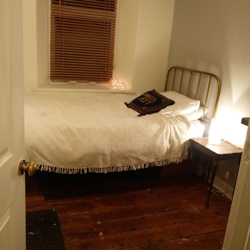 Photo 1: bedroom with large single vintage bed