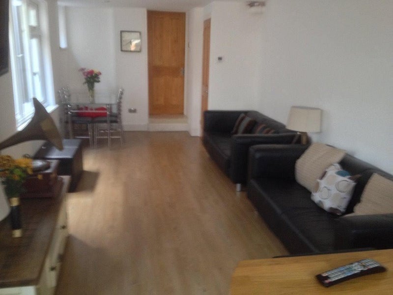 Photo 1: Living/Dining area