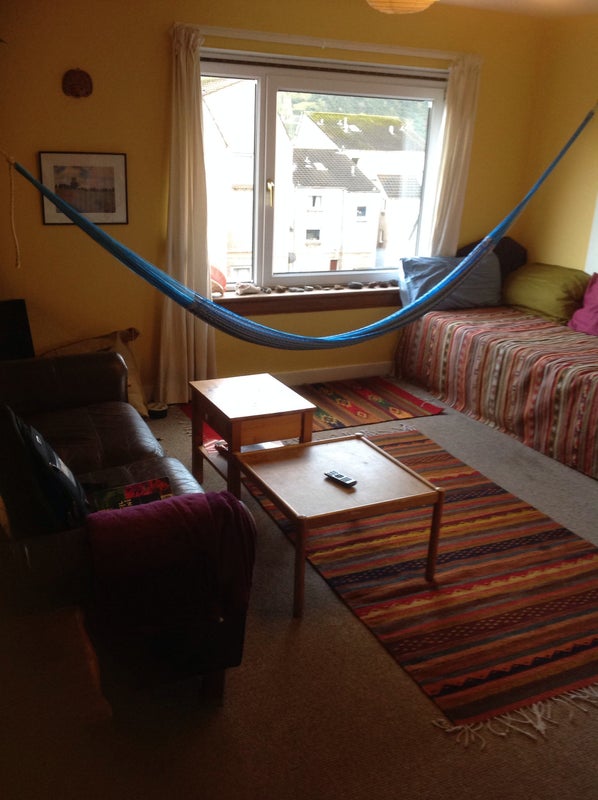 Photo 1: Living room. We like our hammocks. Not visible here is the view to Arthur's Seat.