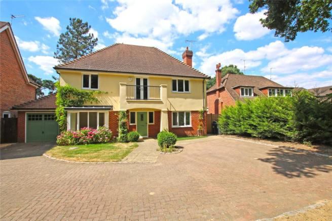 Photo 1: Front with parking 