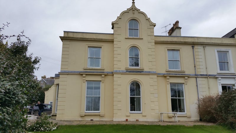 Photo 1: Rear view of house